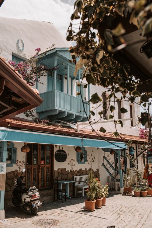 Free A picturesque street in Antalya, Turkey with vintage architecture and vibrant flora. Stock Photo