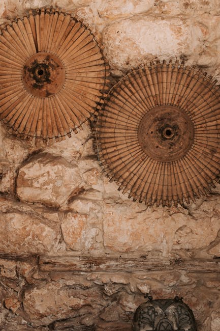 Artistic stone wall adorned with vintage circular decor, creating a rustic feel.