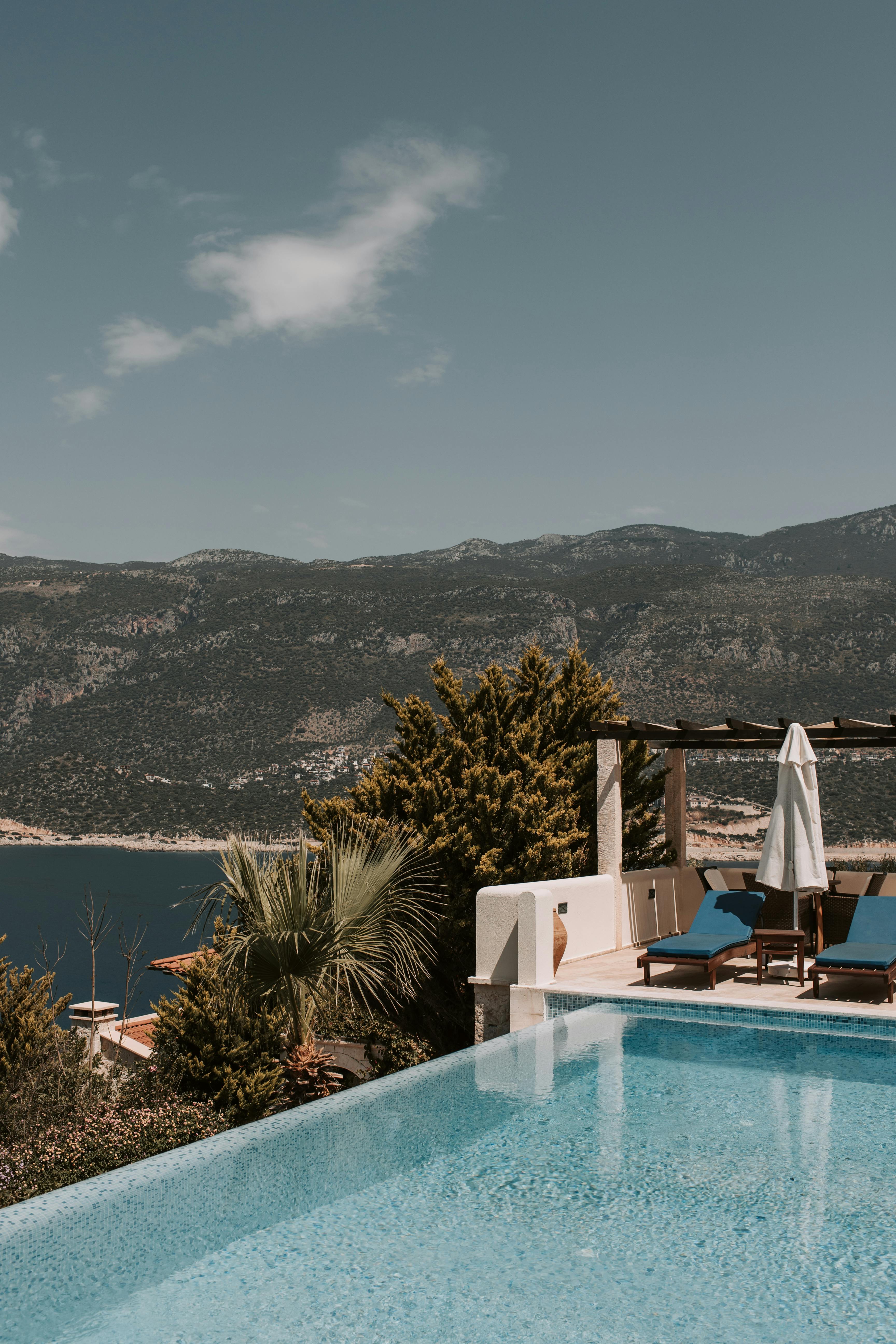 swimming pool with view of mountain and sea