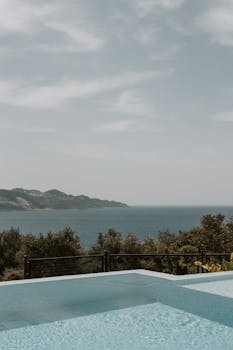 Relaxing seascape overlooking the Mediterranean from a tranquil infinity pool in Kaş, Turkey.