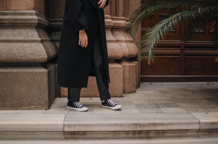 Printed sneakers on a city stoop — photo by Gül Işık on Pexels