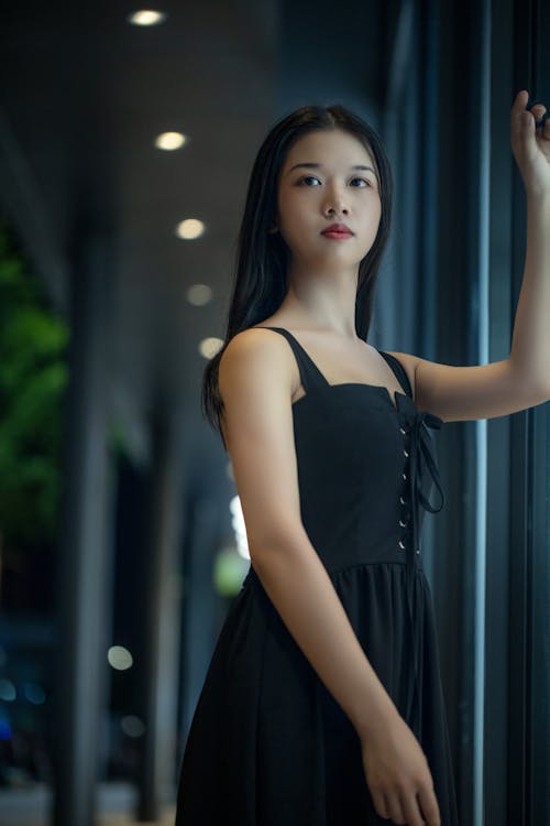 Portrait of a Young Fashion Model Wearing a Black Dress