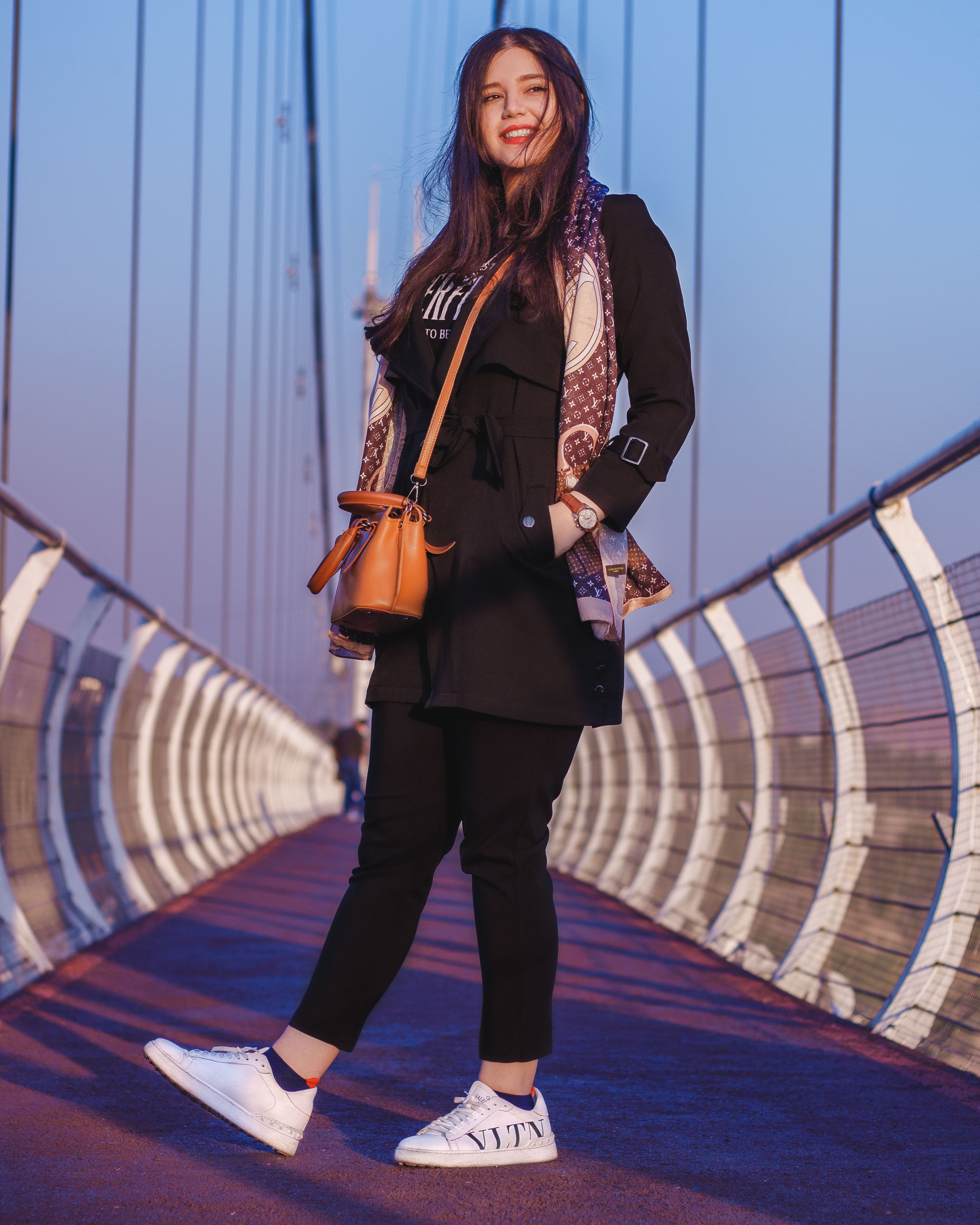 Stylish Young Woman Posing on Bridge · Free Stock Photo
