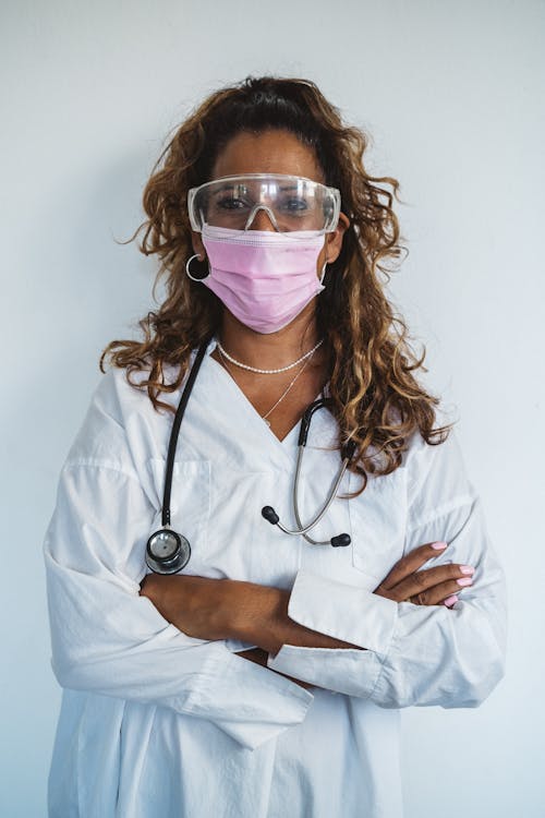A Doctor in White Lab Coat Wearing Face Mask