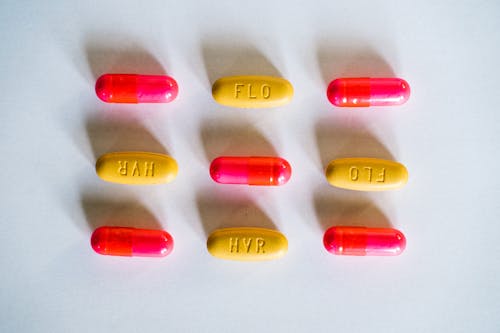 Kostnadsfri bild av avhjälpa, gula piller, horisontell