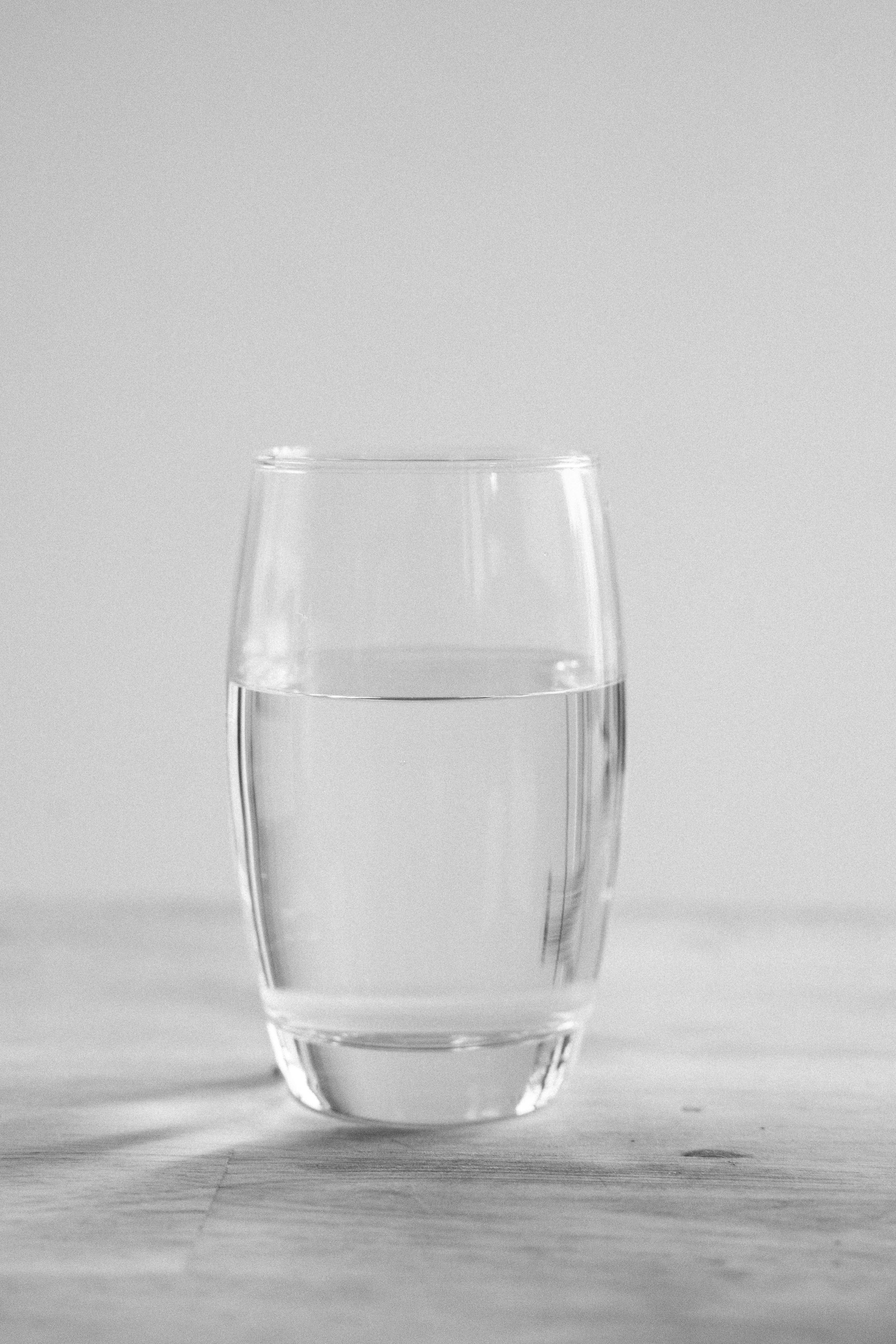 Royalty-Free photo: Clear drinking glass with body of water