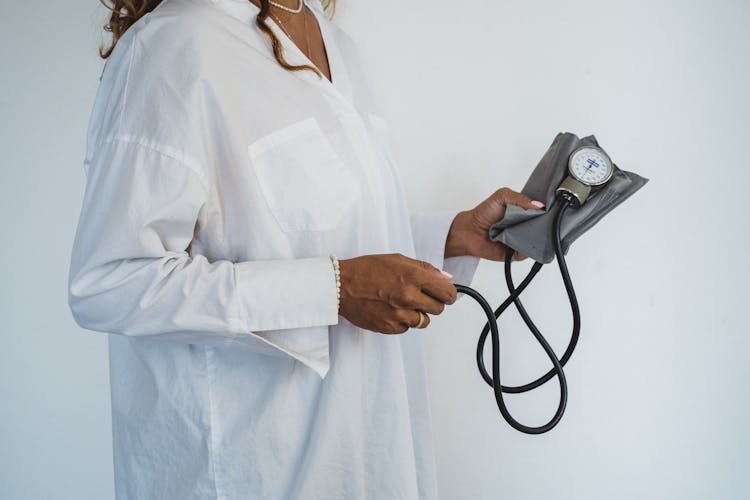 Woman Holding A Blood Pressure Monitor