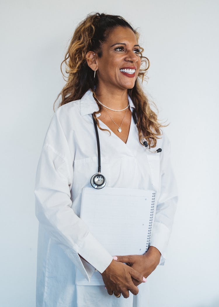Woman In White Medical Gown Smiling