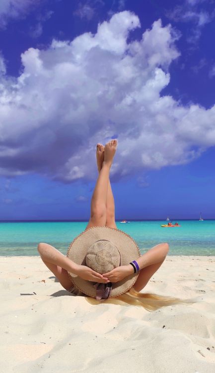 Photograph of a Woman Lying on the Sand · Free Stock Photo