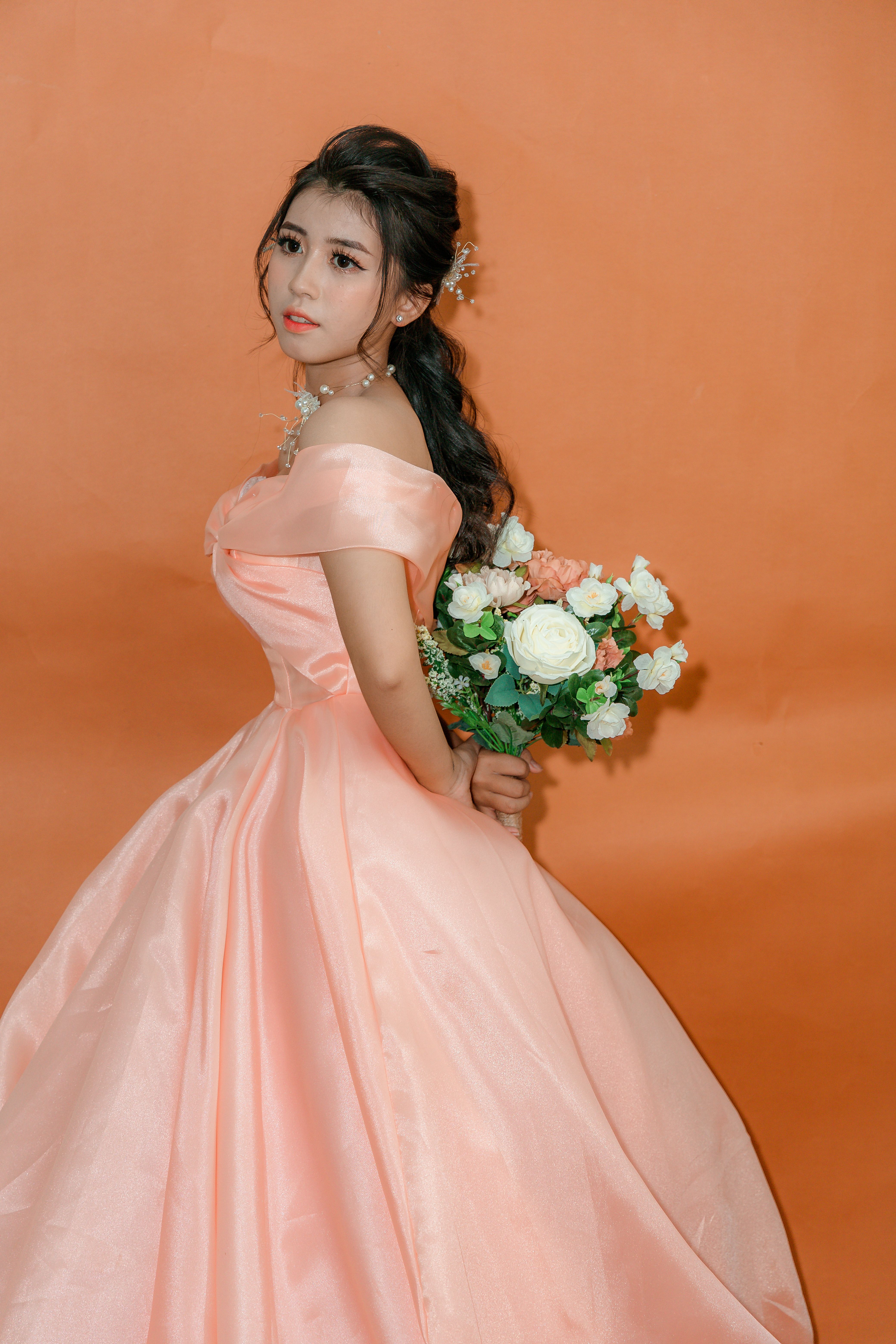 Girl in Pink Dress Holding Bouquet of Flowers · Free Stock Photo