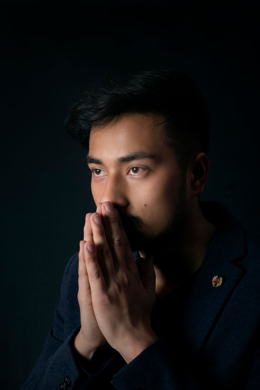 Thoughtful portrait of a man with hands together by Shuseel Maharjan on Pexels