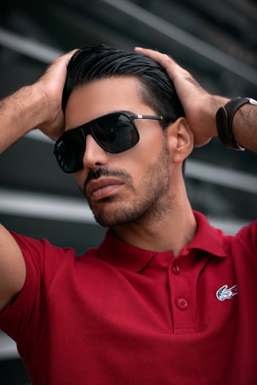 Free Man in Red Polo Shirt Wearing Black Sunglasses Stock Photo