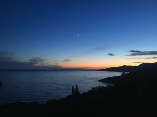 Free Stunning dusk view over the sea from Istanbul with moonlit sky and calm waters. Stock Photo