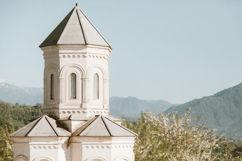 Ancient Building Tower in Mountain Landscape 