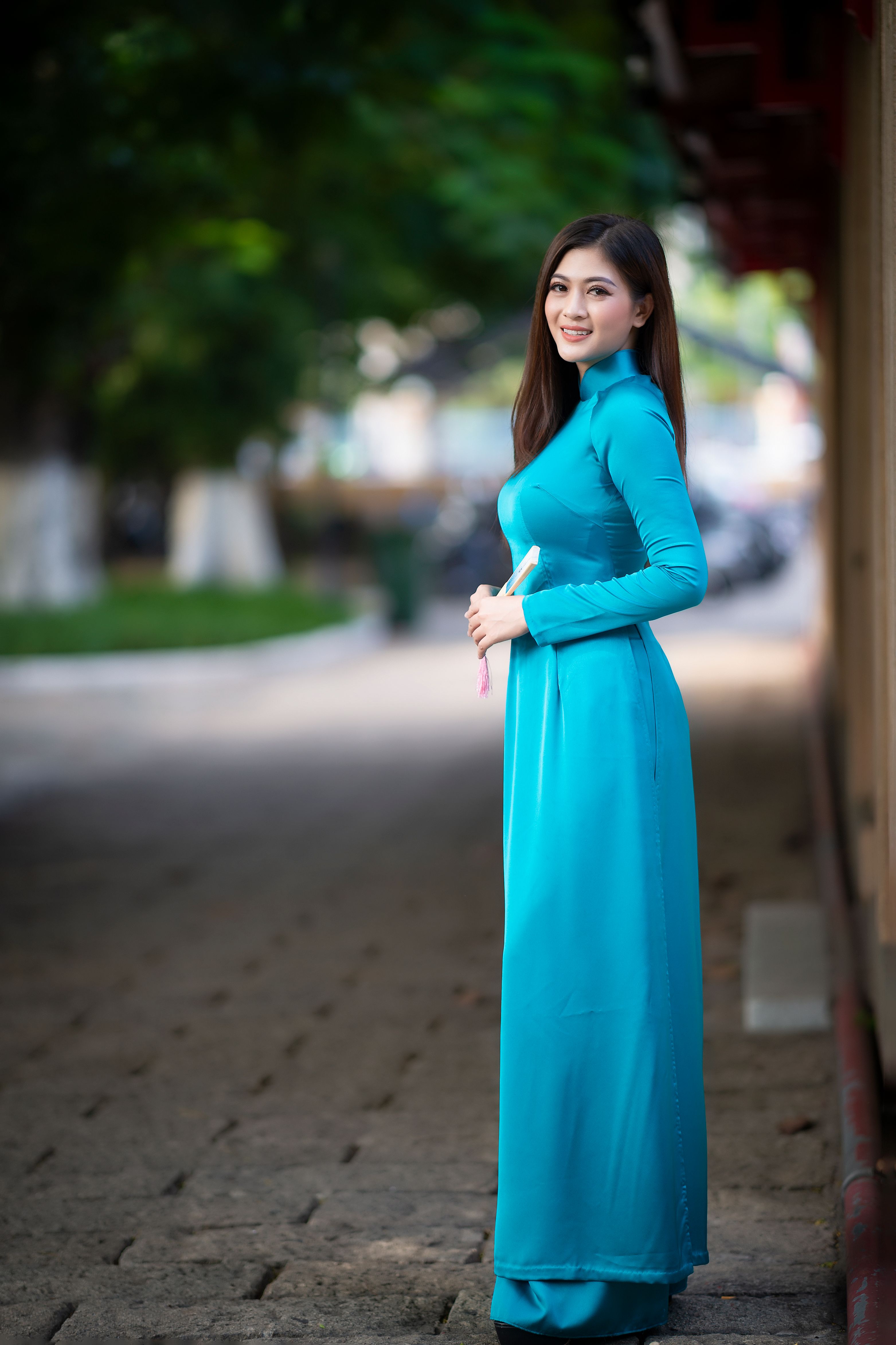 A Pretty Woman in Blue Dress Standing · Free Stock Photo