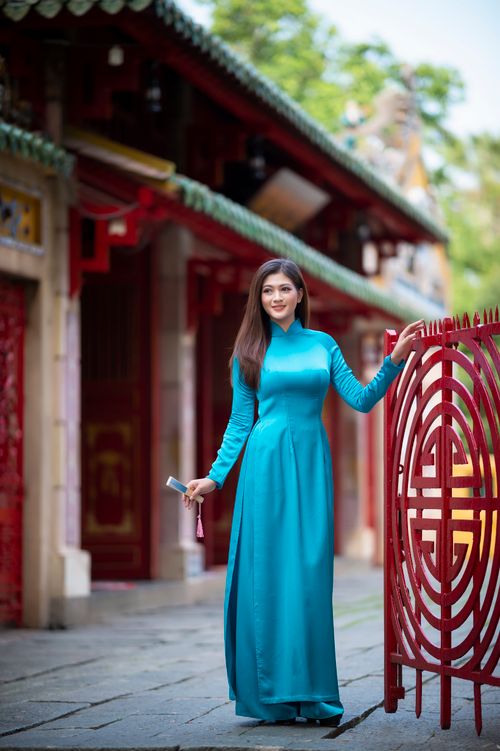 A Pretty Woman in Blue Dress Standing · Free Stock Photo