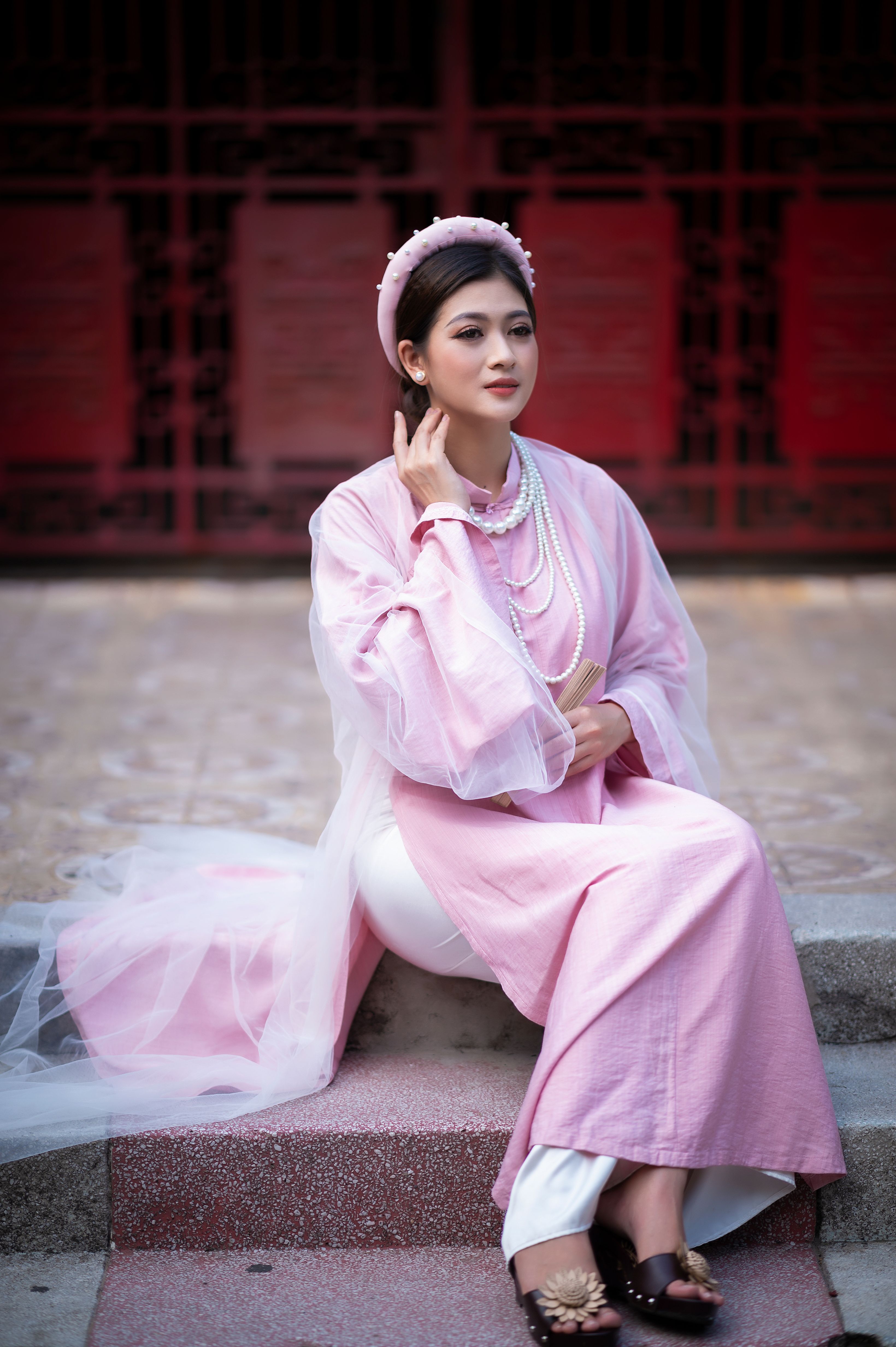 A Woman in Pink Dress Sitting on a Concrete Steps · Free Stock Photo
