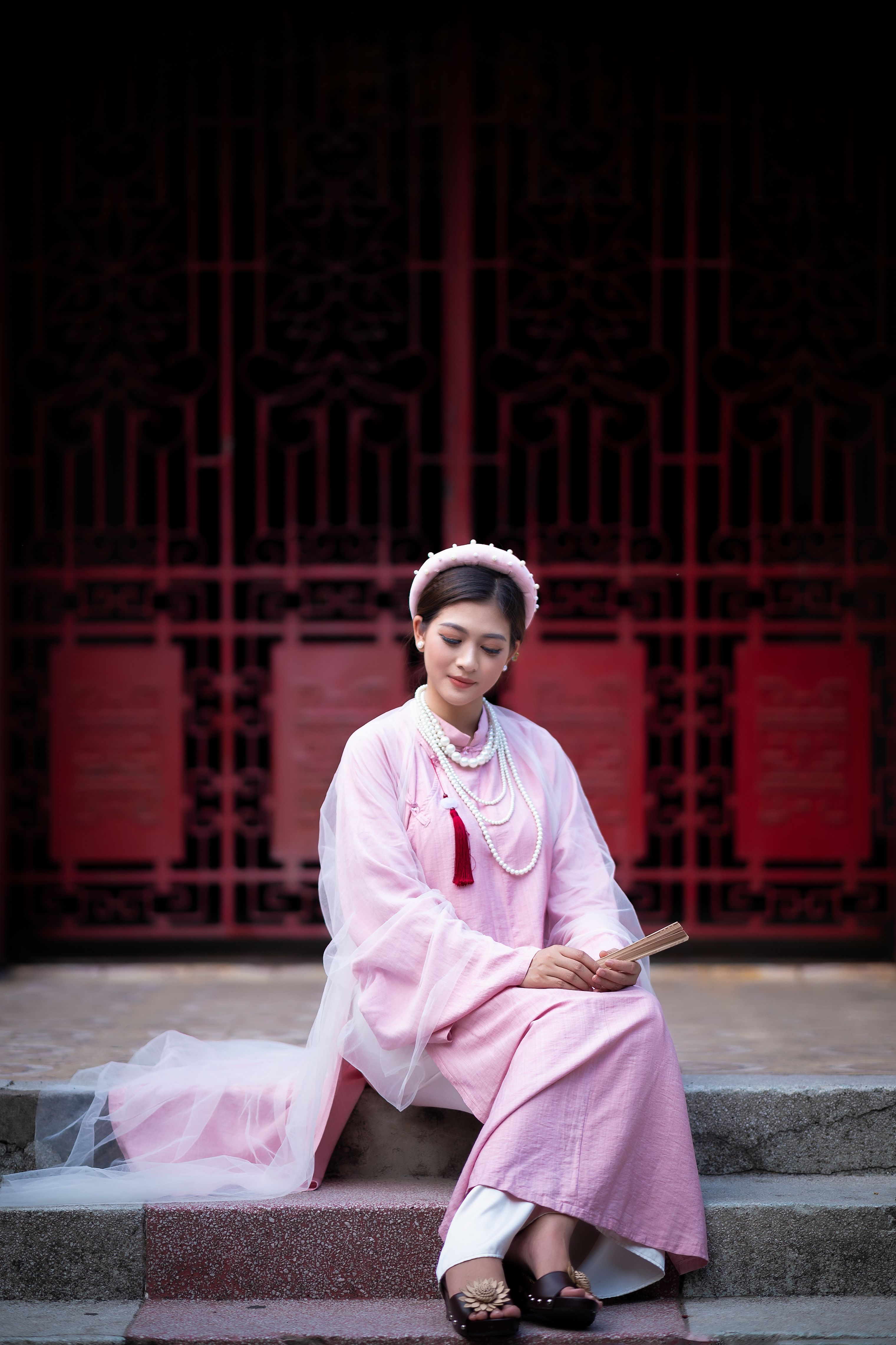 A Woman wearing Pink Dress Sitting on the Stairs · Free Stock Photo