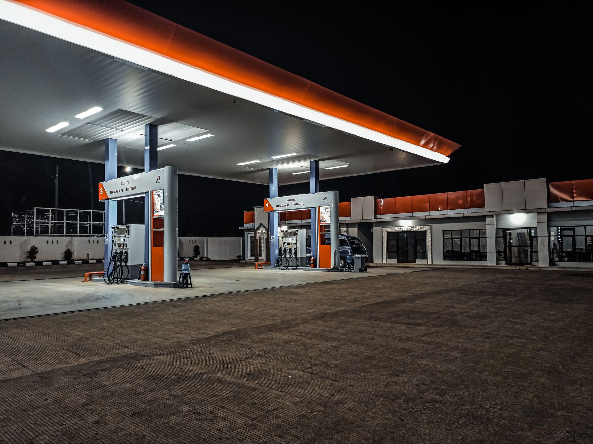Modern petrol pumps at a fuel station forecourt