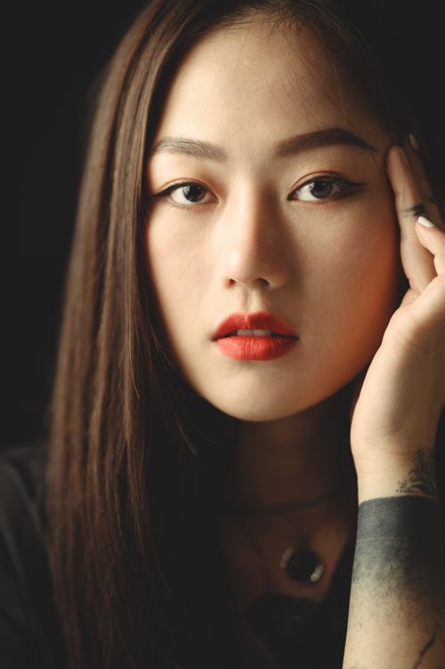Free Close-up portrait of an Asian woman with bold makeup and tattoo in Ho Chi Minh City. Stock Photo