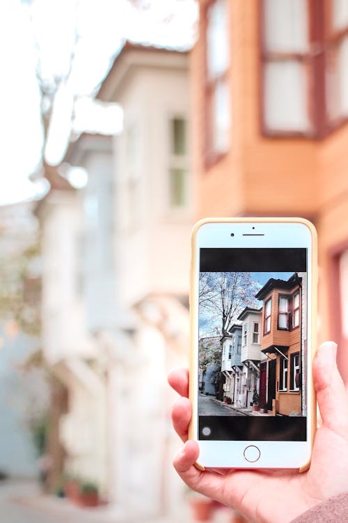 Close-Up Shot of a Person Taking Picture Using a Smartphone