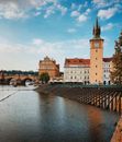Brown Concrete Clock Tower with Spires in Praque, Czechia