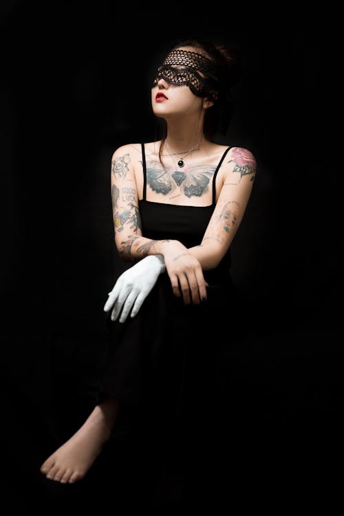 Free A Tattooed Woman in Black Spaghetti Strap Top Stock Photo
