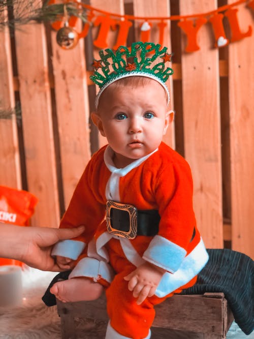 A Young Boy wearing Santa Costume