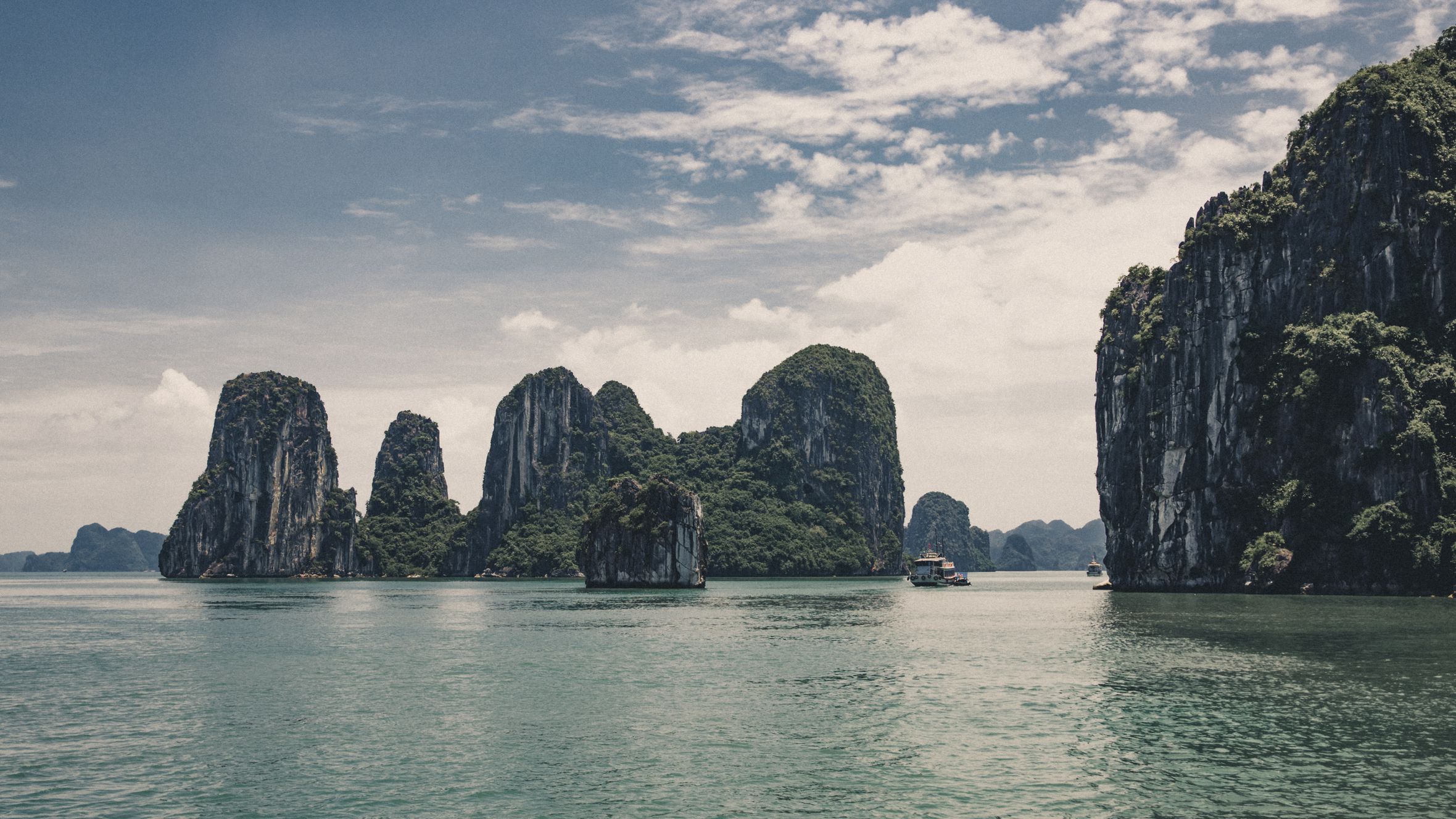 Explore the breathtaking limestone formations of Ha Long Bay, a UNESCO World Heritage site in Vietnam.