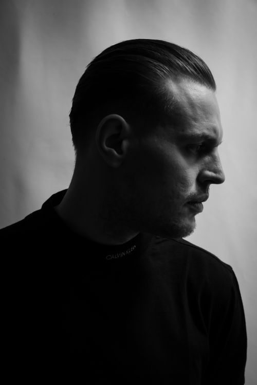 Free A striking black and white side profile portrait of a man with a serious expression. Stock Photo