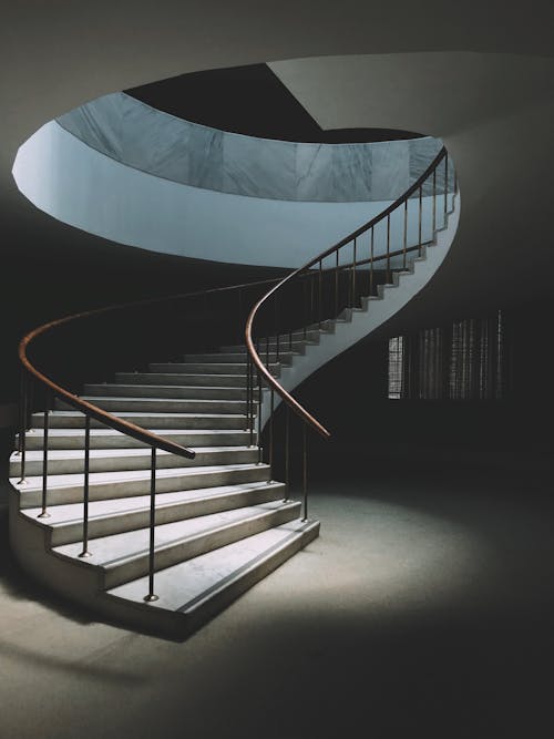 Free Spiral staircase with railings in modern building Stock Photo