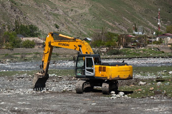 Excavator working rocky ground