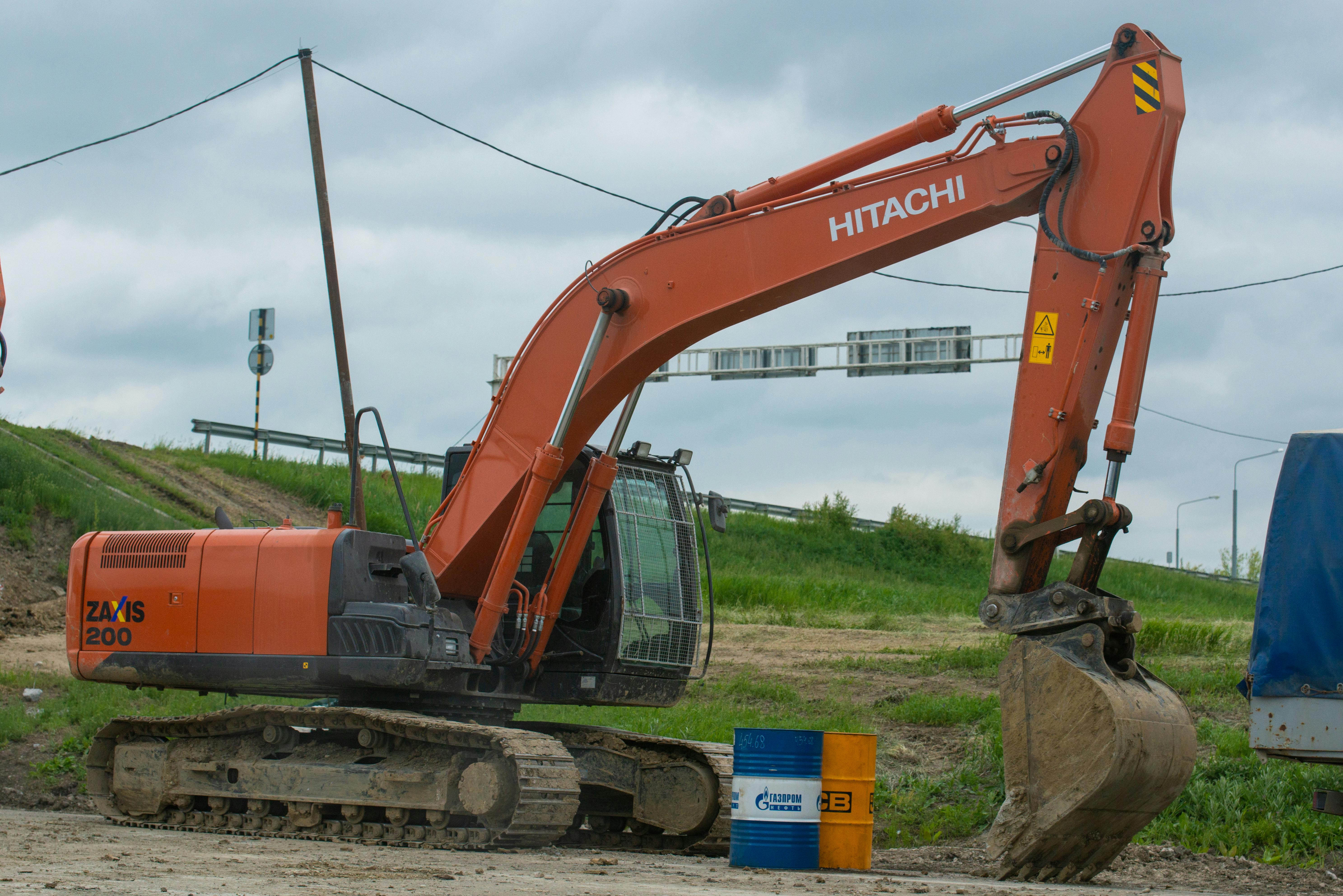 A Hitachi excavator on site, ready for construction work, illustrating heavy machinery in action.