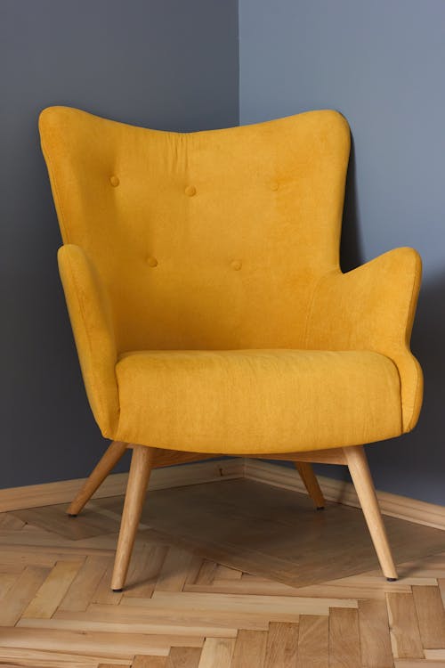 Free Yellow Chair on the Wooden Floor Stock Photo
