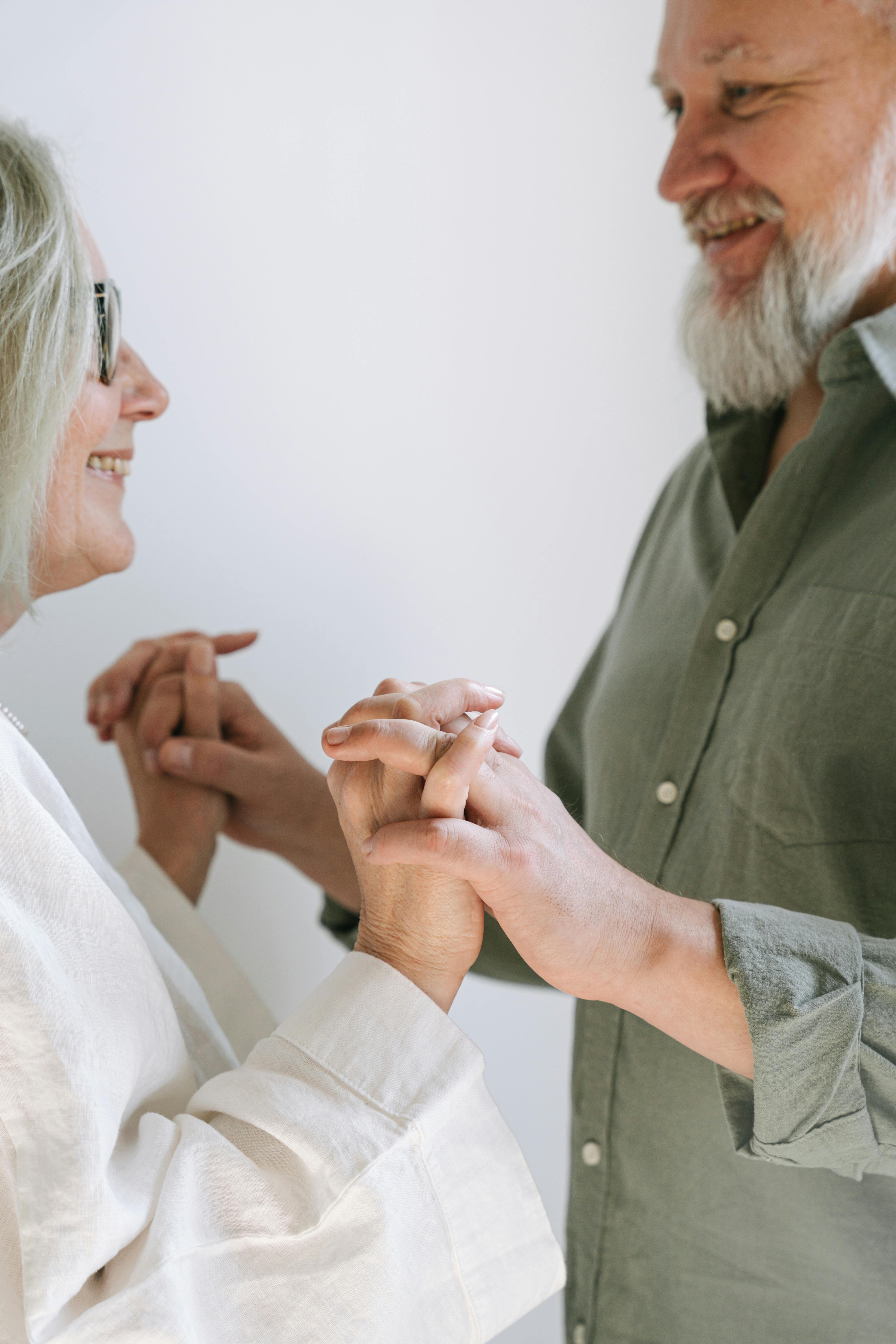 a couple holding their hands