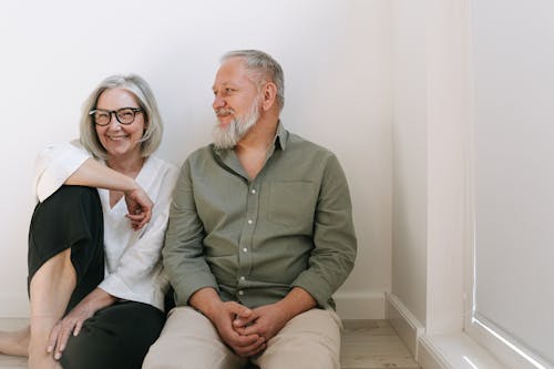 Man and Woman Sitting on the Floor