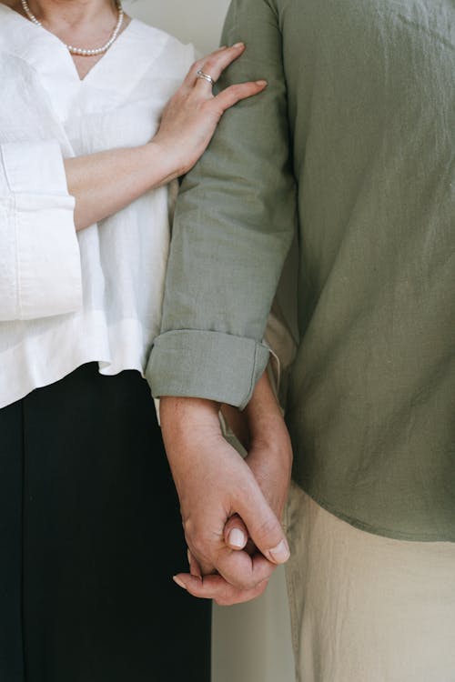 A Couple Holding Each Others Hand