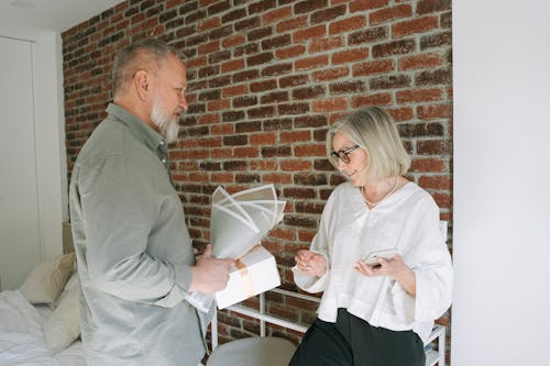 Free Man Giving Gifts to a Woman Stock Photo
