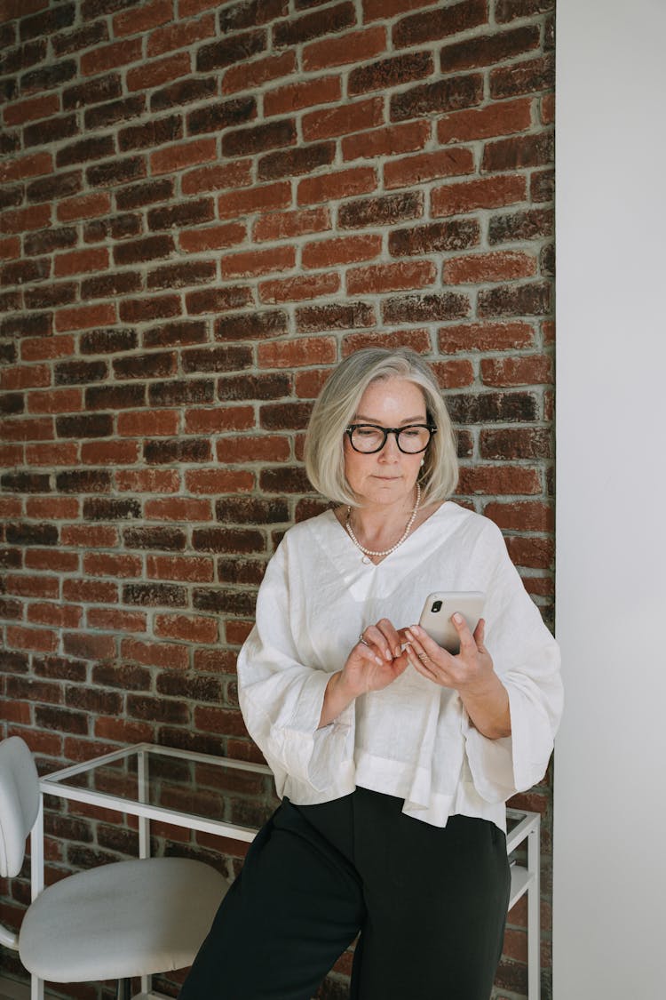 Portrait Of A Mature Woman Using A Smartphone