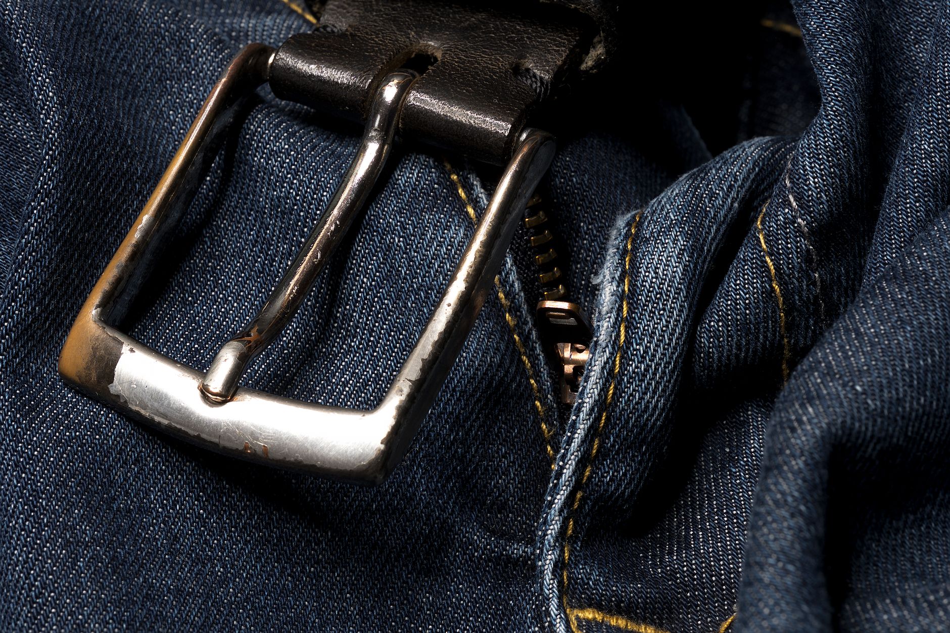 Interior view of a tailored trouser's waistband and inseam construction, showing the finish quality details that determine context range score independent of silhouette