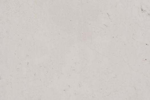 Close-up view of a plain white marble surface with subtle texture and patterns.