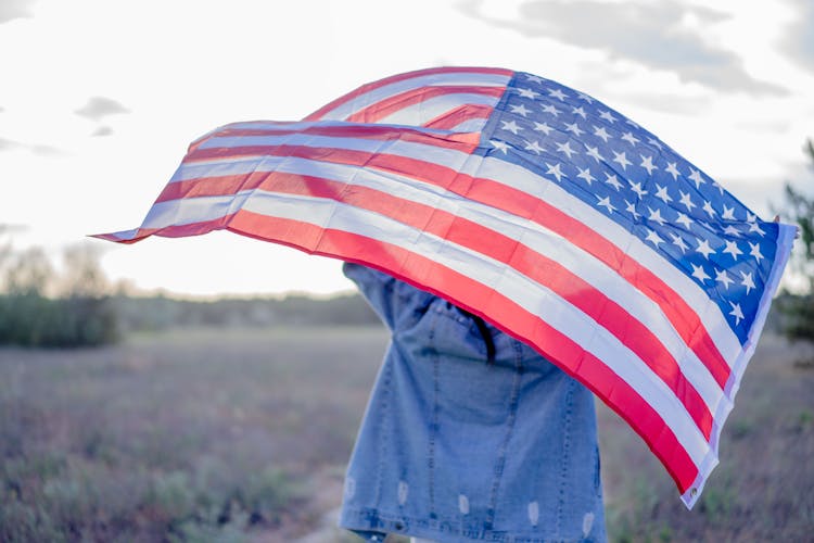 Unrecognizable Person With American Flag