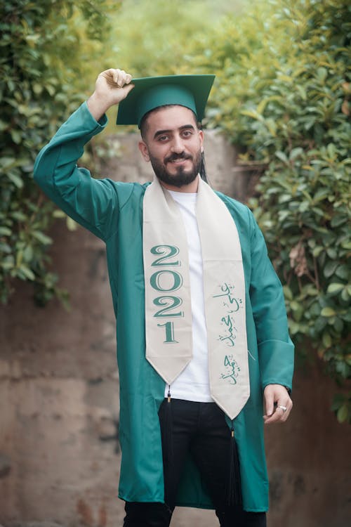 Free Man in Green Graduation Gown and Cap Stock Photo