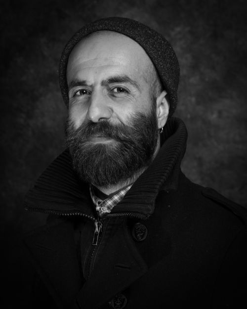 Free Artistic monochrome portrait of a bearded man in a beanie, showcasing a thoughtful expression. Stock Photo