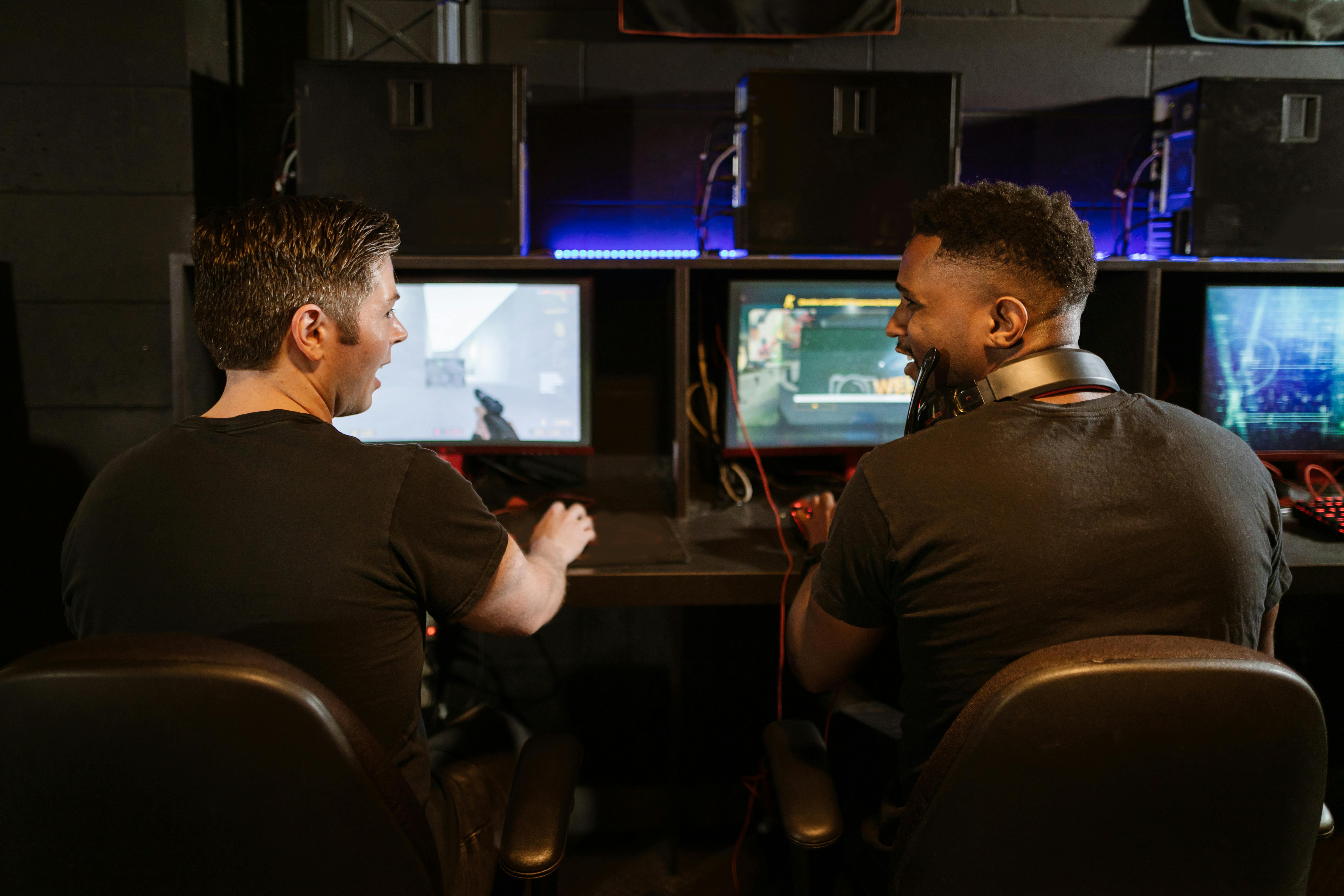 Men Relax By Playing Competitive Video Games As Friends In A Local Internet  Bar That Specializes In Online Gaming Stock Photo, Picture and Royalty Free  Image. Image 81203430.