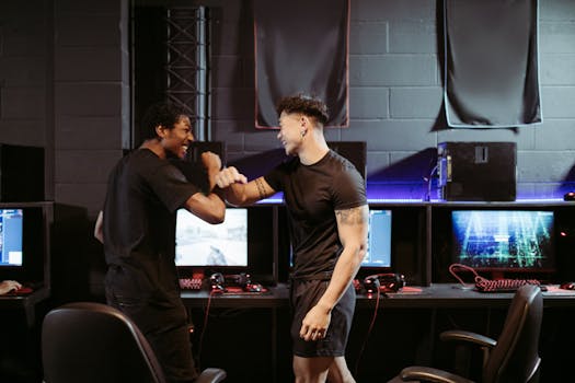 Two friends celebrating a win in a gaming arcade, showcasing excitement and joy.