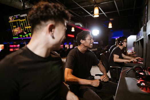 Group of friends enthusiastically playing video games in a modern arcade setting.
