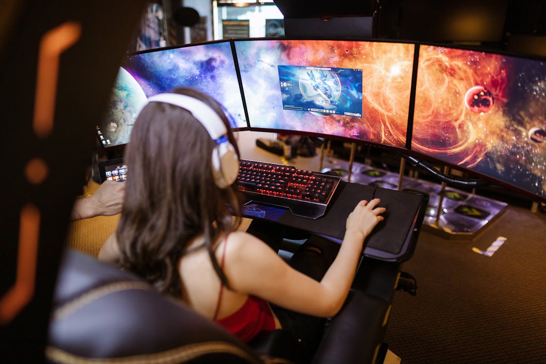 Free A Woman Playing a Video Game Stock Photo