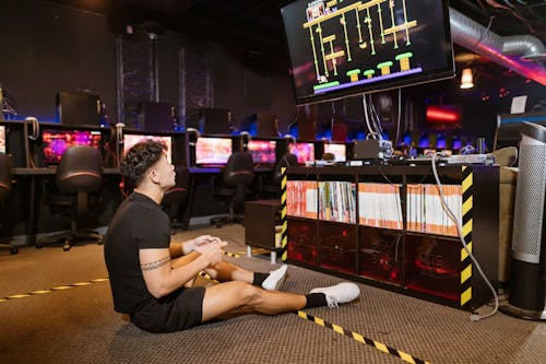 Man in Black Shirt Playing Video Game