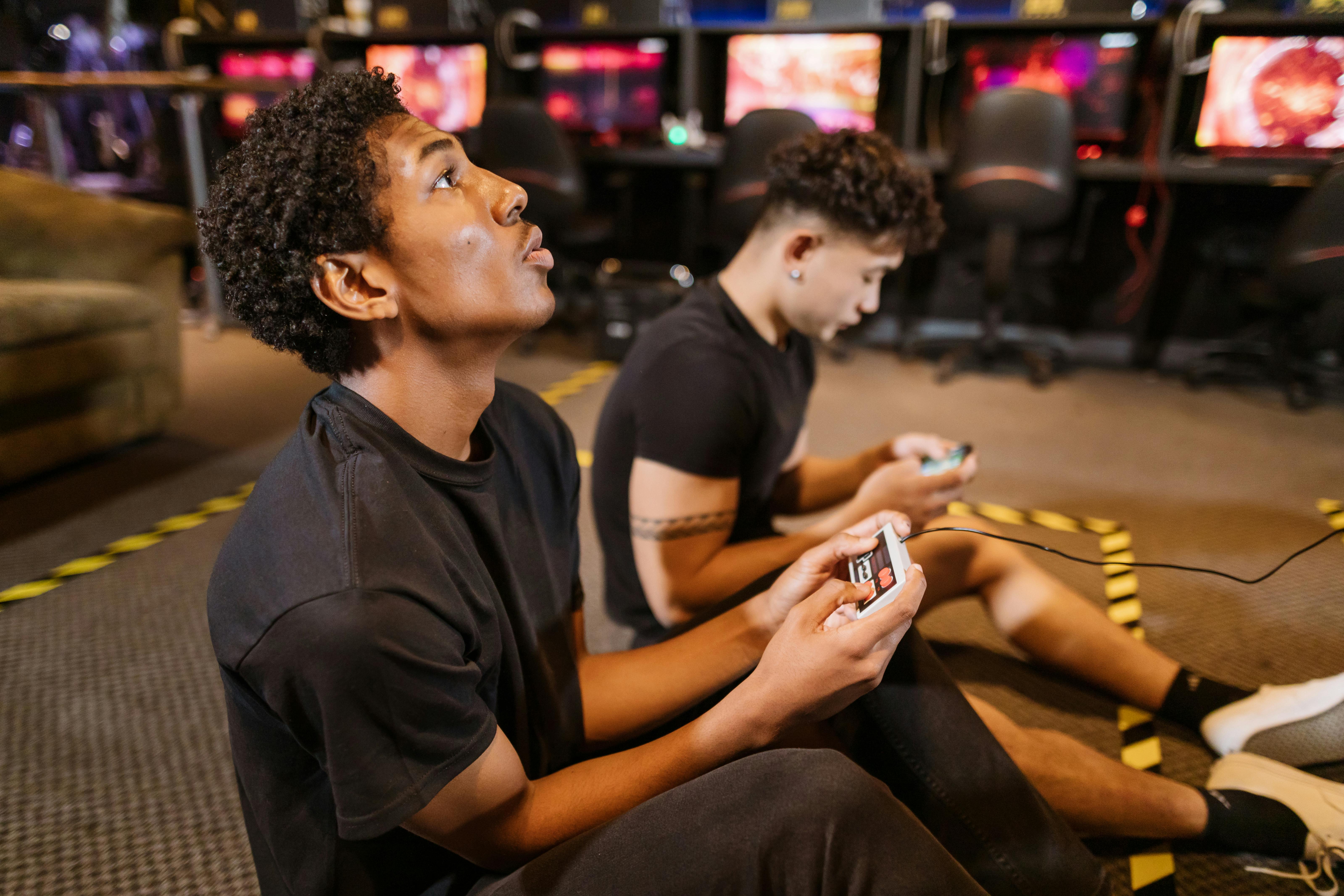 Men Relax By Playing Competitive Video Games As Friends In A Local Internet  Bar That Specializes In Online Gaming Stock Photo, Picture and Royalty Free  Image. Image 81203430.